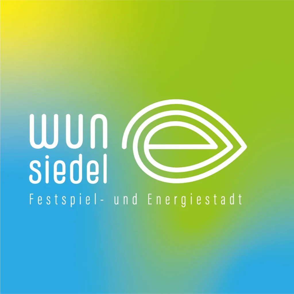 Logo der Stadt Wunsiedel auf buntem Untergrund